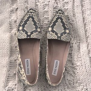 Leather flats with snake skin design. Worn once.